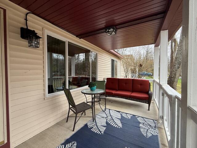 206 Great Oak Dr, Roscommon, MI 48653 - sunroom featuring plenty of natural light