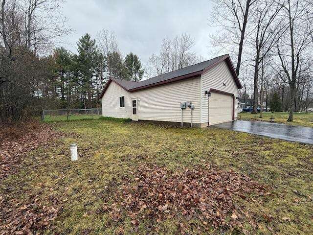 206 Great Oak Dr, Roscommon, MI 48653 - view of side of property featuring asphalt driveway