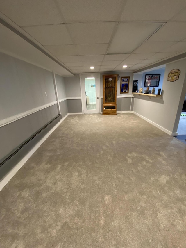 3143 Poplar Ave, Grayling, MI 49738 - finished below grade area featuring a paneled ceiling, carpet flooring, recessed lighting, and a baseboard radiator
