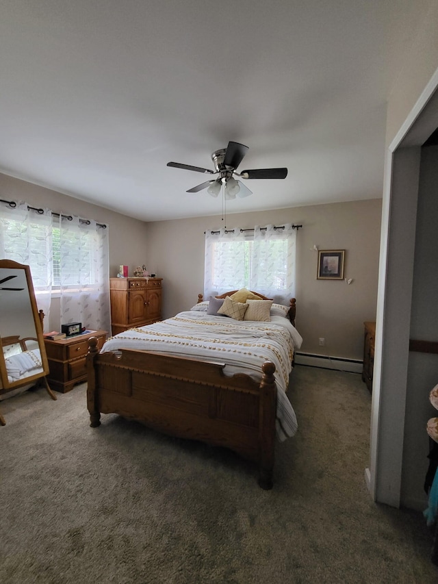 3143 Poplar Ave, Grayling, MI 49738 - carpeted bedroom with a baseboard radiator and a ceiling fan