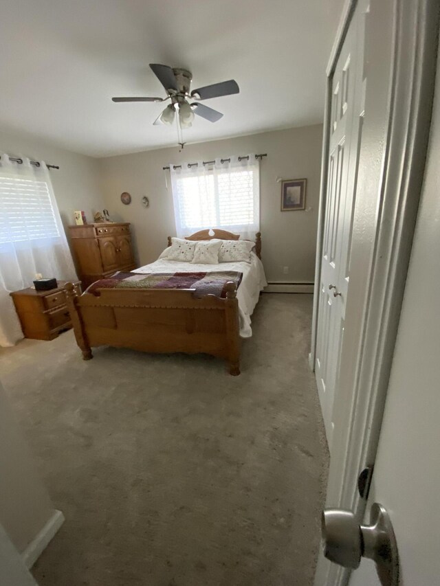 3143 Poplar Ave, Grayling, MI 49738 - bedroom featuring light colored carpet and a ceiling fan