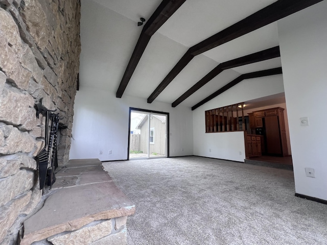 unfurnished living room featuring carpet floors and baseboards