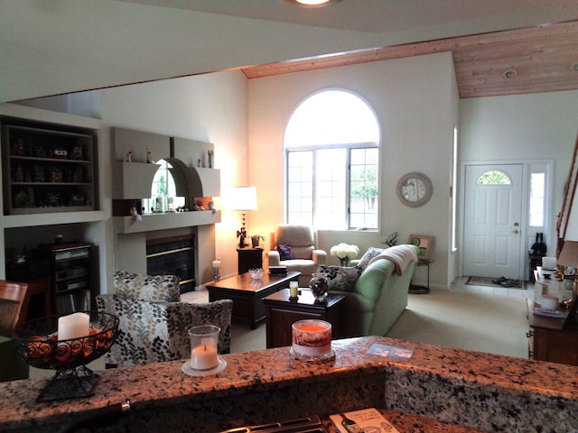 living room with a glass covered fireplace