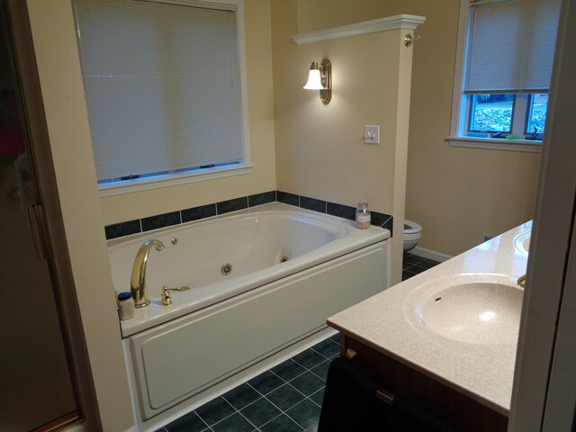 bathroom with vanity, a whirlpool tub, tile patterned floors, and toilet