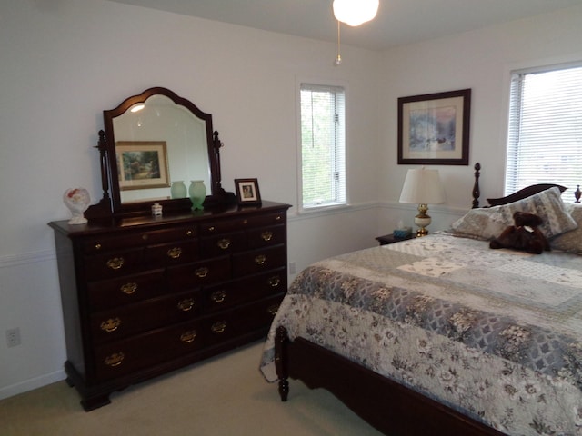 bedroom featuring light colored carpet