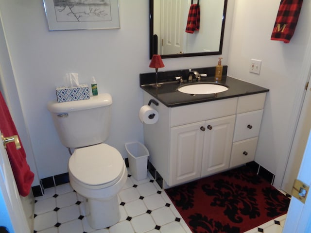 bathroom with toilet and vanity