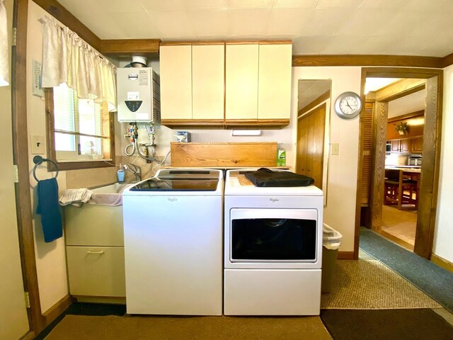 10328 Toohy Trl, Harrison, MI 48625 - laundry room featuring tankless water heater, cabinet space, separate washer and dryer, carpet, and baseboards