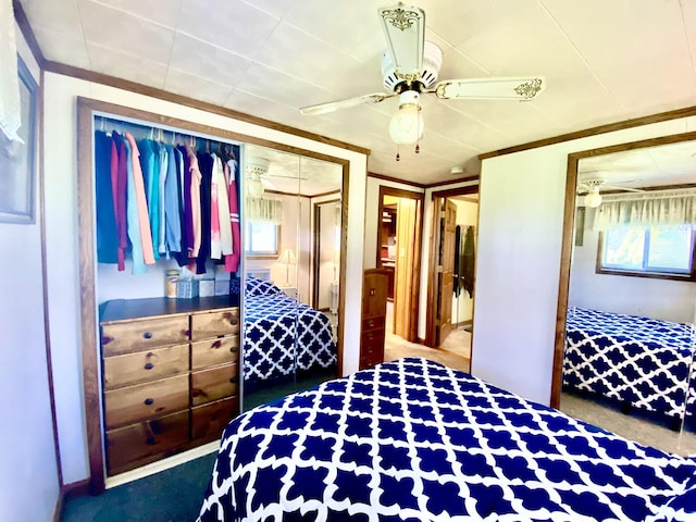 10328 Toohy Trl, Harrison, MI 48625 - carpeted bedroom featuring a closet, a ceiling fan, and crown molding
