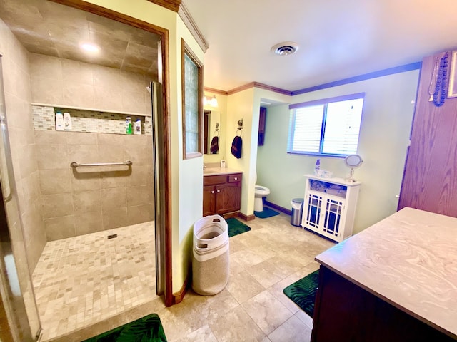 10328 Toohy Trl, Harrison, MI 48625 - bathroom with a tile shower, toilet, vanity, baseboards, and tile patterned flooring