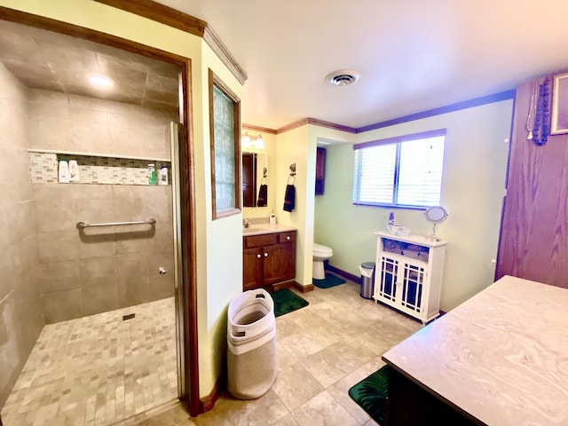 10328 Toohy Trl, Harrison, MI 48625 - full bath with tiled shower, toilet, vanity, baseboards, and tile patterned flooring