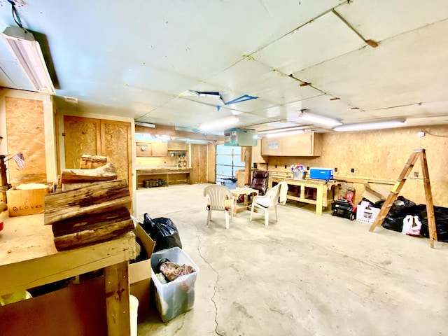 10328 Toohy Trl, Harrison, MI 48625 - miscellaneous room featuring a workshop area and unfinished concrete floors