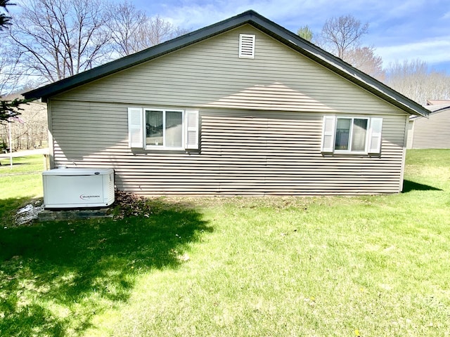 10328 Toohy Trl, Harrison, MI 48625 - view of side of home with a lawn