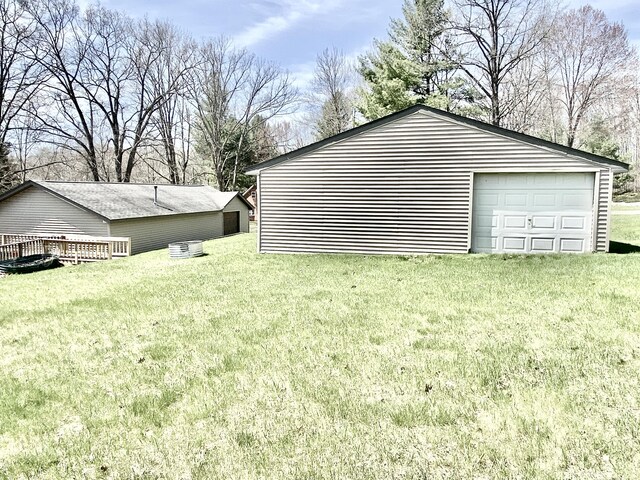 10328 Toohy Trl, Harrison, MI 48625 - view of grassy yard with a garage and an outdoor structure