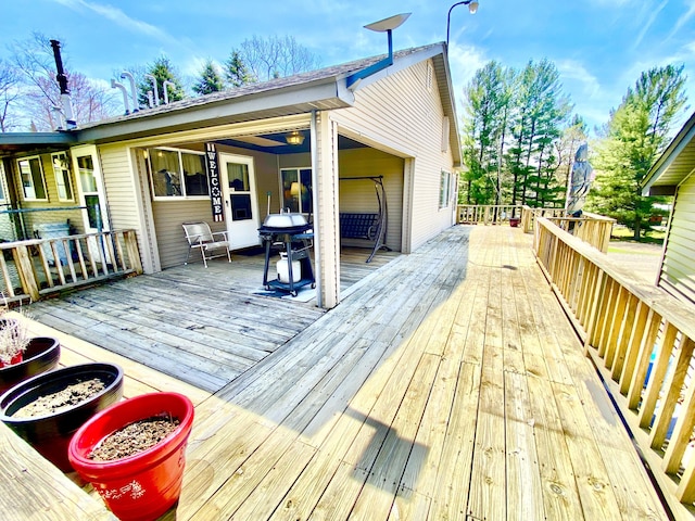 10328 Toohy Trl, Harrison, MI 48625 - wooden terrace with area for grilling