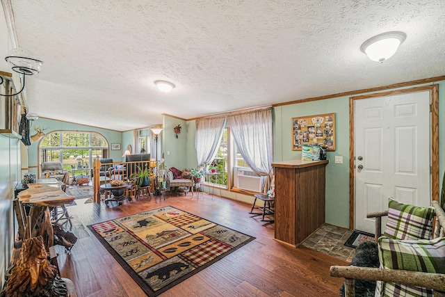 8978 Starvation Lake Rd, Mancelona, MI 49659 - foyer entrance with a textured ceiling, wood finished floors, crown molding, and cooling unit