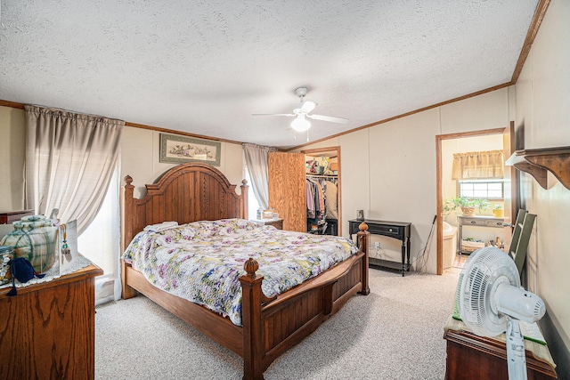 8978 Starvation Lake Rd, Mancelona, MI 49659 - bedroom with vaulted ceiling, crown molding, light colored carpet, a textured ceiling, and a closet