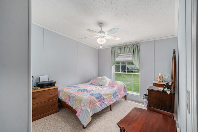 8978 Starvation Lake Rd, Mancelona, MI 49659 - bedroom with ornamental molding, carpet, ceiling fan, a textured ceiling, and a decorative wall