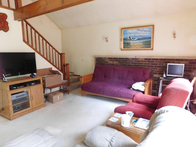8727 S Oak Rd, Grayling, MI 49738 - carpeted living room featuring stairs and vaulted ceiling