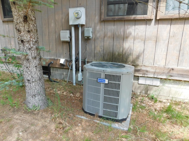 8727 S Oak Rd, Grayling, MI 49738 - exterior view of central AC and electric meter