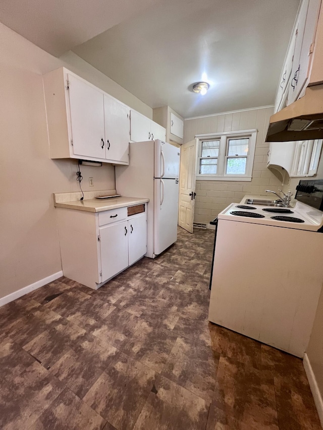 kitchen featuring white appliances, under cabinet range hood, light countertops, white cabinetry, and baseboards