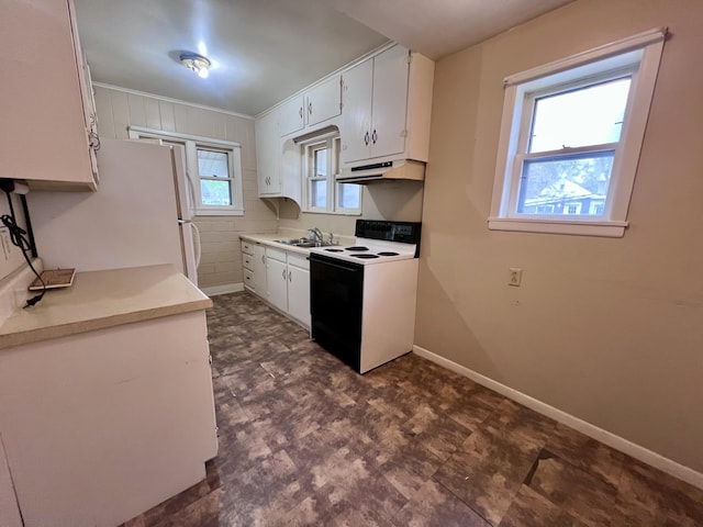 kitchen with electric stove, under cabinet range hood, a sink, and white cabinets