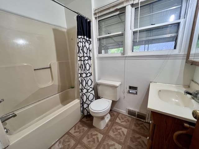 bathroom with shower / tub combo with curtain, toilet, and vanity