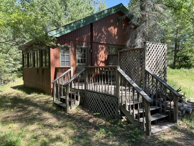 8842 Jackson Hole Trl, Grayling, MI 49738 - wooden deck with stairs
