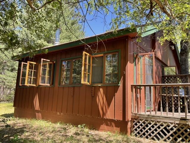 8842 Jackson Hole Trl, Grayling, MI 49738 - view of home's exterior featuring a deck