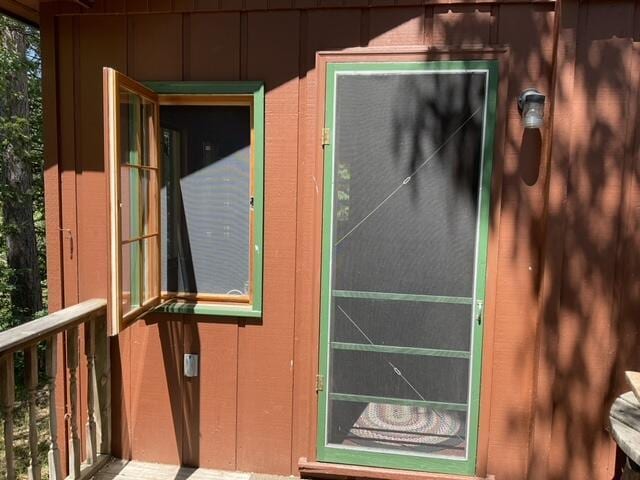 8842 Jackson Hole Trl, Grayling, MI 49738 - entrance to property with board and batten siding