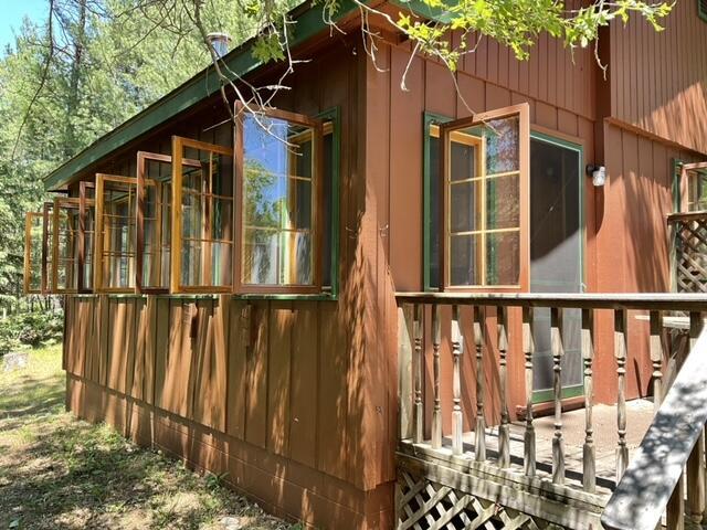 8842 Jackson Hole Trl, Grayling, MI 49738 - view of side of property featuring a wooden deck