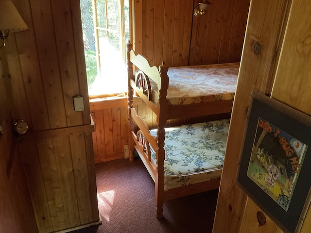 8842 Jackson Hole Trl, Grayling, MI 49738 - bedroom with carpet and wooden walls