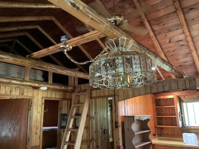 8842 Jackson Hole Trl, Grayling, MI 49738 - detailed view of wooden walls, a chandelier, wood ceiling, and beam ceiling