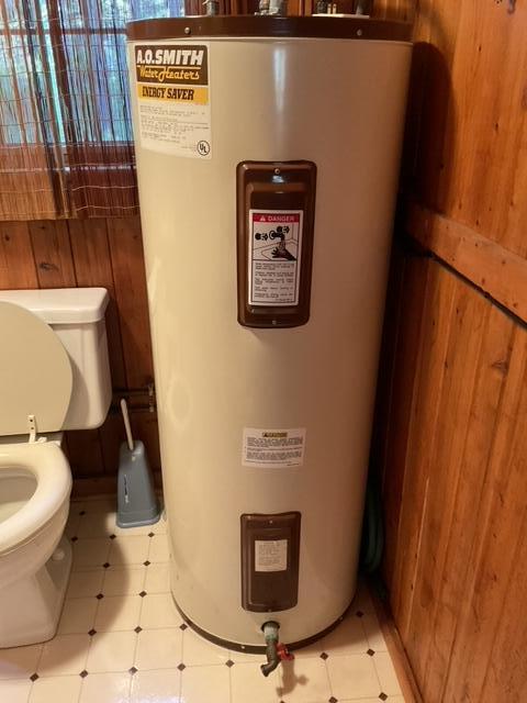 8842 Jackson Hole Trl, Grayling, MI 49738 - utility room with water heater