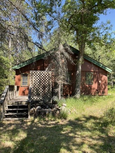 8842 Jackson Hole Trl, Grayling, MI 49738 - back of house with a deck