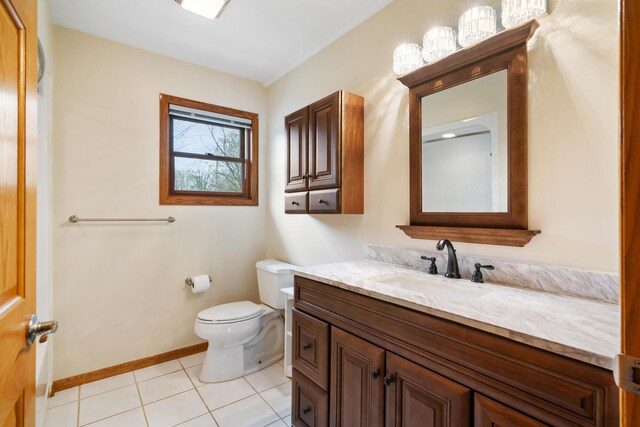 301 Hugh St, East Jordan, MI 49727 - bathroom with toilet, tile patterned floors, vanity, and baseboards