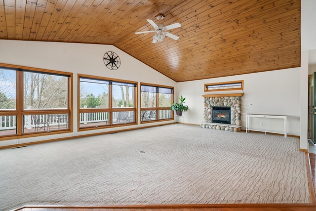 301 Hugh St, East Jordan, MI 49727 - unfurnished living room featuring high vaulted ceiling, ceiling fan, wooden ceiling, a fireplace, and carpet flooring