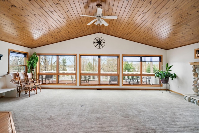 301 Hugh St, East Jordan, MI 49727 - living area featuring vaulted ceiling, carpet flooring, ceiling fan, and wooden ceiling