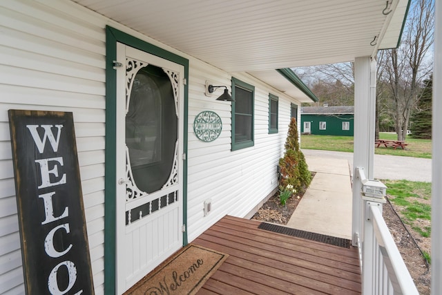 301 Hugh St, East Jordan, MI 49727 - view of exterior entry with covered porch