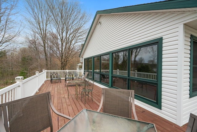 301 Hugh St, East Jordan, MI 49727 - wooden deck featuring outdoor dining area