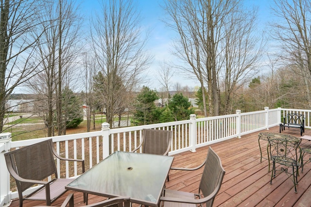 301 Hugh St, East Jordan, MI 49727 - wooden terrace featuring outdoor dining space