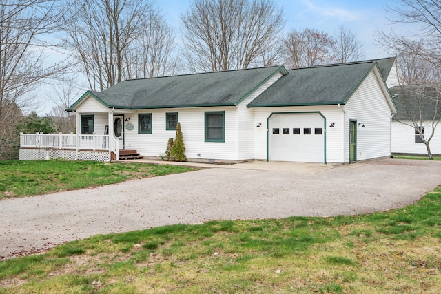301 Hugh St, East Jordan, MI 49727 - ranch-style house featuring a garage, driveway, a front yard, and a shingled roof