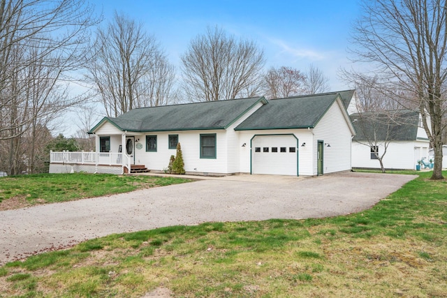 301 Hugh St, East Jordan, MI 49727 - single story home featuring an attached garage, driveway, covered porch, a front lawn, and a shingled roof