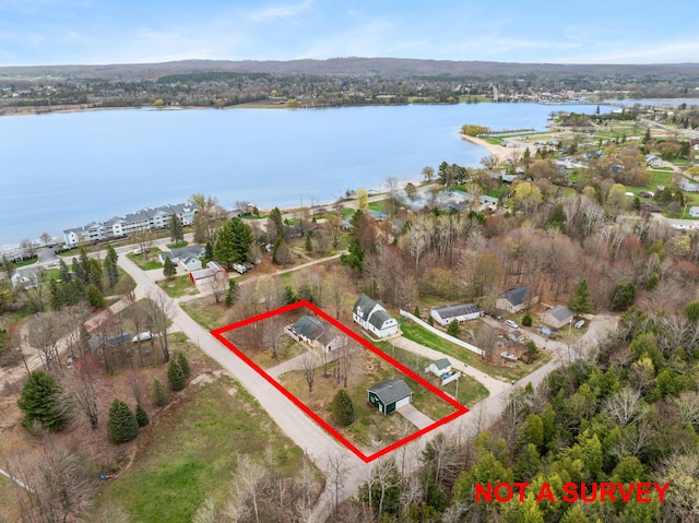 301 Hugh St, East Jordan, MI 49727 - view of property location featuring property boundaries highlighted and a large body of water