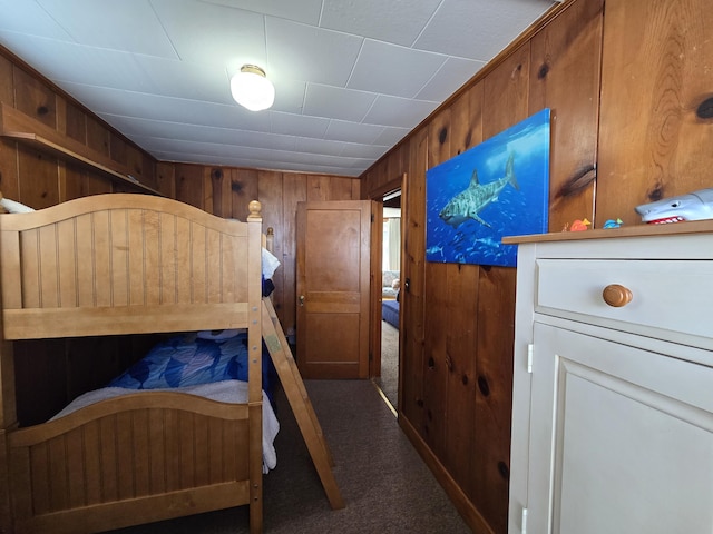 204 Broadway Rd, Houghton Lake, MI 48629 - carpeted bedroom with wood walls