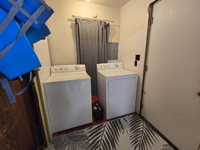 204 Broadway Rd, Houghton Lake, MI 48629 - clothes washing area featuring washer and dryer and electric panel
