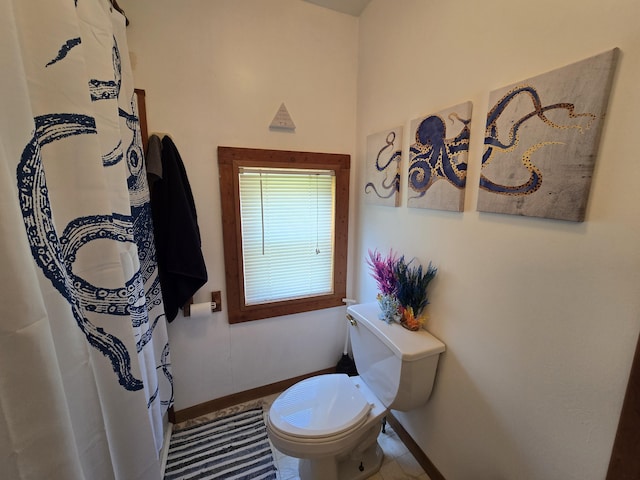 204 Broadway Rd, Houghton Lake, MI 48629 - full bath with baseboards, toilet, tile patterned floors, and curtained shower