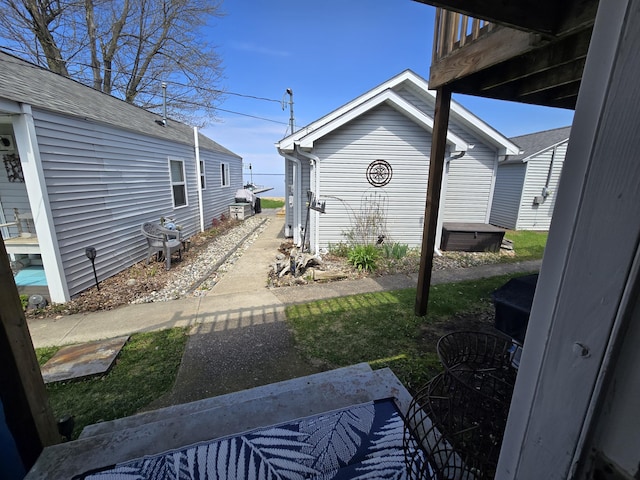204 Broadway Rd, Houghton Lake, MI 48629 - view of yard featuring a hot tub