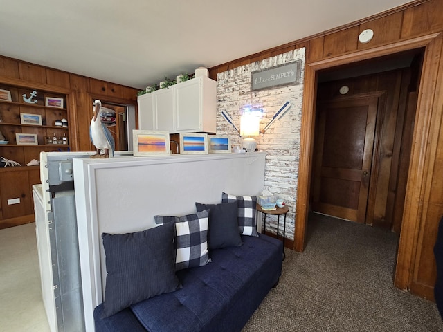 204 Broadway Rd, Houghton Lake, MI 48629 - living area with wood walls and carpet