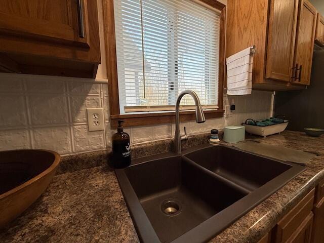 kitchen with a sink and brown cabinets