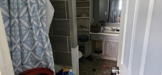 1220 Court St, Cheboygan, MI 49721 - bathroom featuring toilet, vanity, and a shower with shower curtain